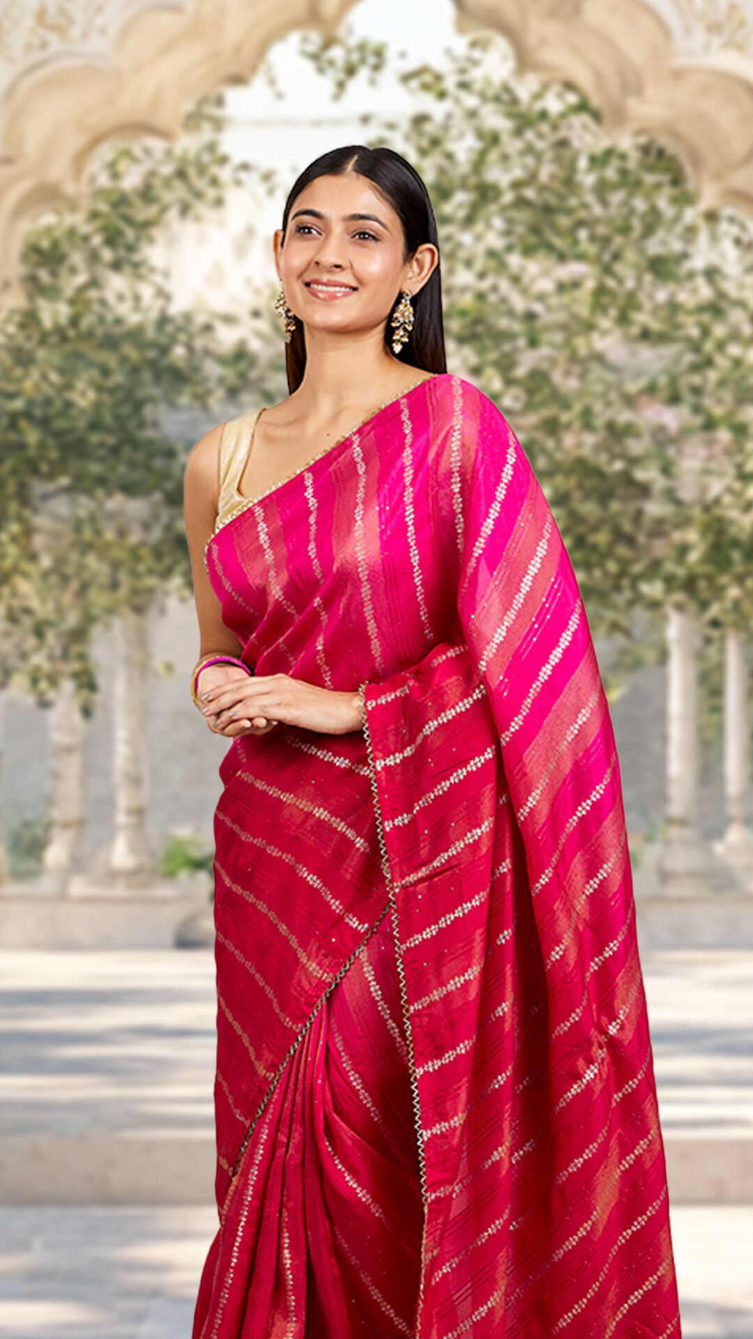Woman wearing a red saree and smiling beautifully during a wedding celebration